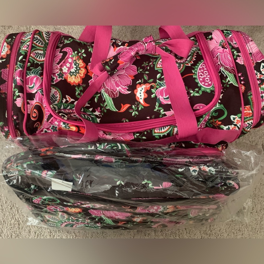 Large tropical floral print duffel bag.
